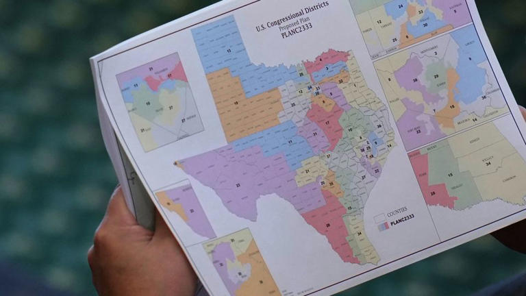 Texas state Sen. Pete Flores, a Republican from Pleasanton, looks over a redrawn congressional map for Texas, at the Texas Capitol in Austin on August 22. - Eric Gay/AP