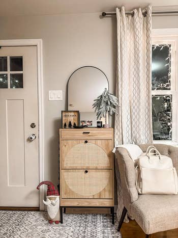 A room entryway with a closed shoe cabinet