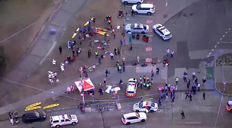 An aerial view of emergency personnel working at the scene of a shooting incident at Bondi Beach (Credits: via REUTERS)