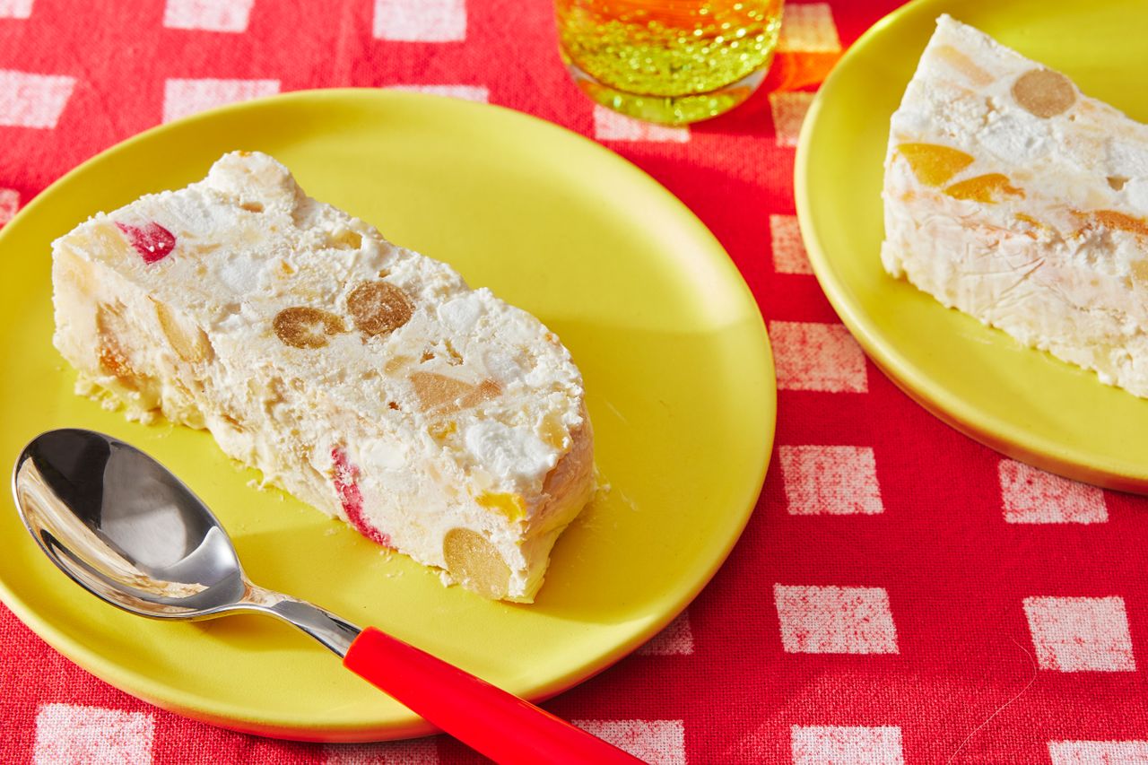 Frozen Fruit Salad sliced on yellow plates to serve