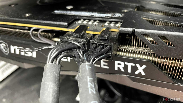 An RTX 3060 Ti graphics card and its power cables.