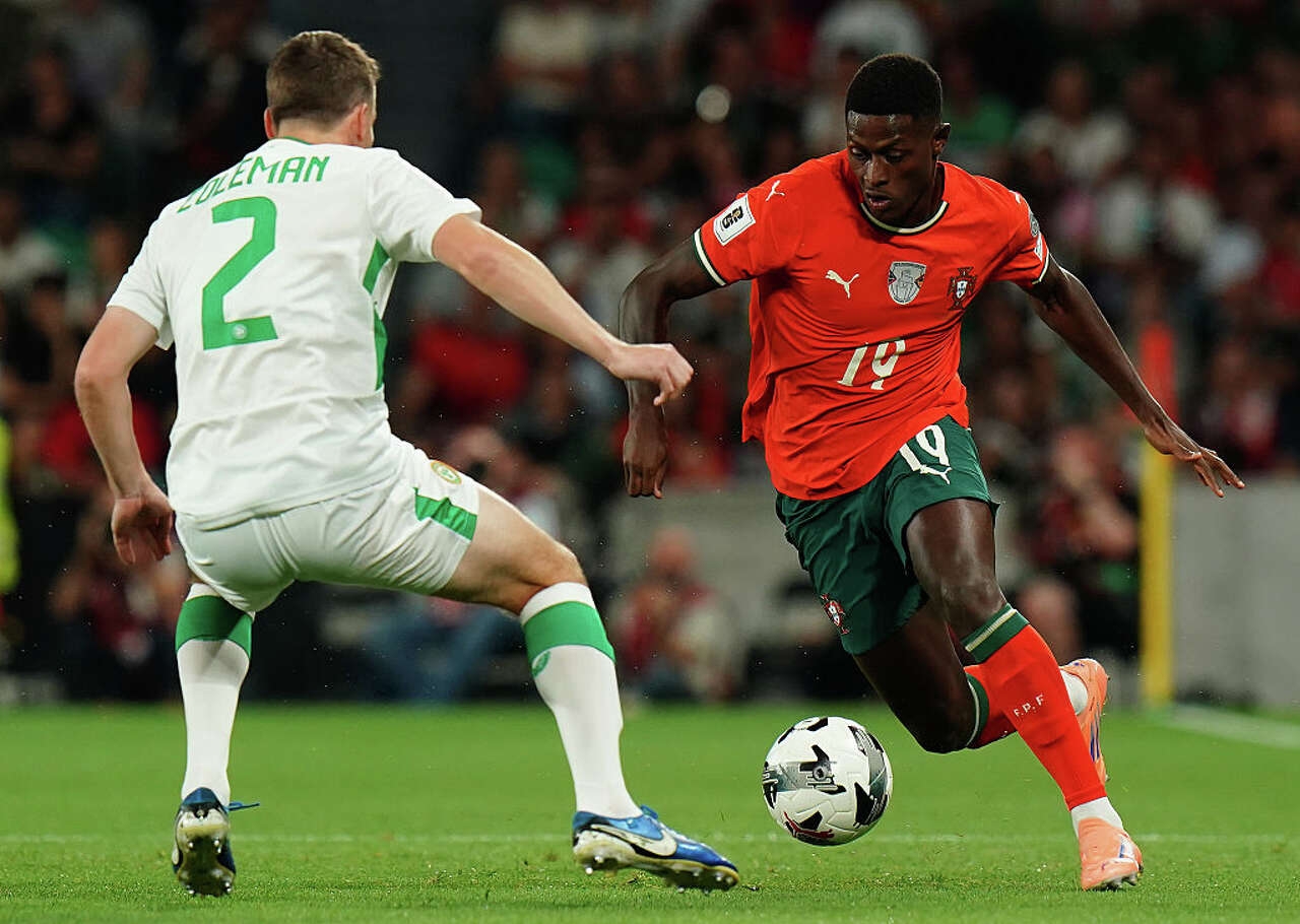 Nuno Mendes of Portugal with Seamus Coleman of Republic of Ireland in action during the FIFA World Cup 2026 Qualifier match between Portugal and Republic of Ireland at Estadio Jose Alvalade on October 11, 2025 in Lisbon, Portugal. (Gualter Fatia/Getty Images)