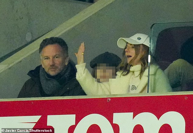 The singer appeared to gesture towards the stands while watching the game on Sunday 