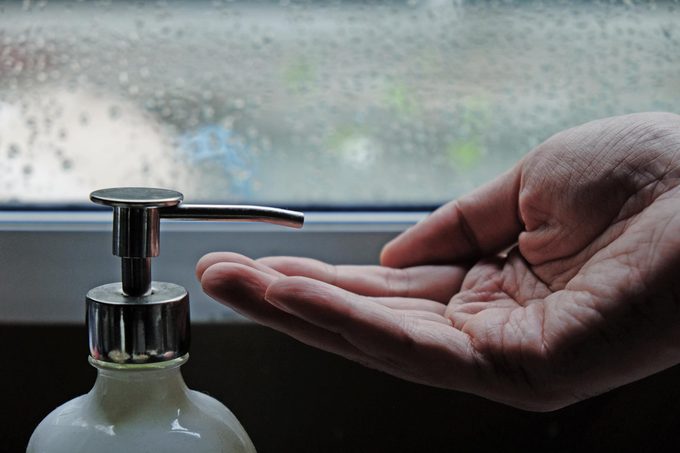 men hand waiting for lotion in raining day, men skin care concept