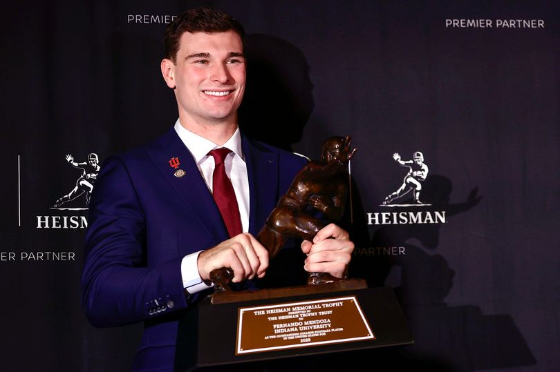 CBS Reporter Targeted With Racial Slurs and ICE Threats After Heisman Trophy Vote<br>
