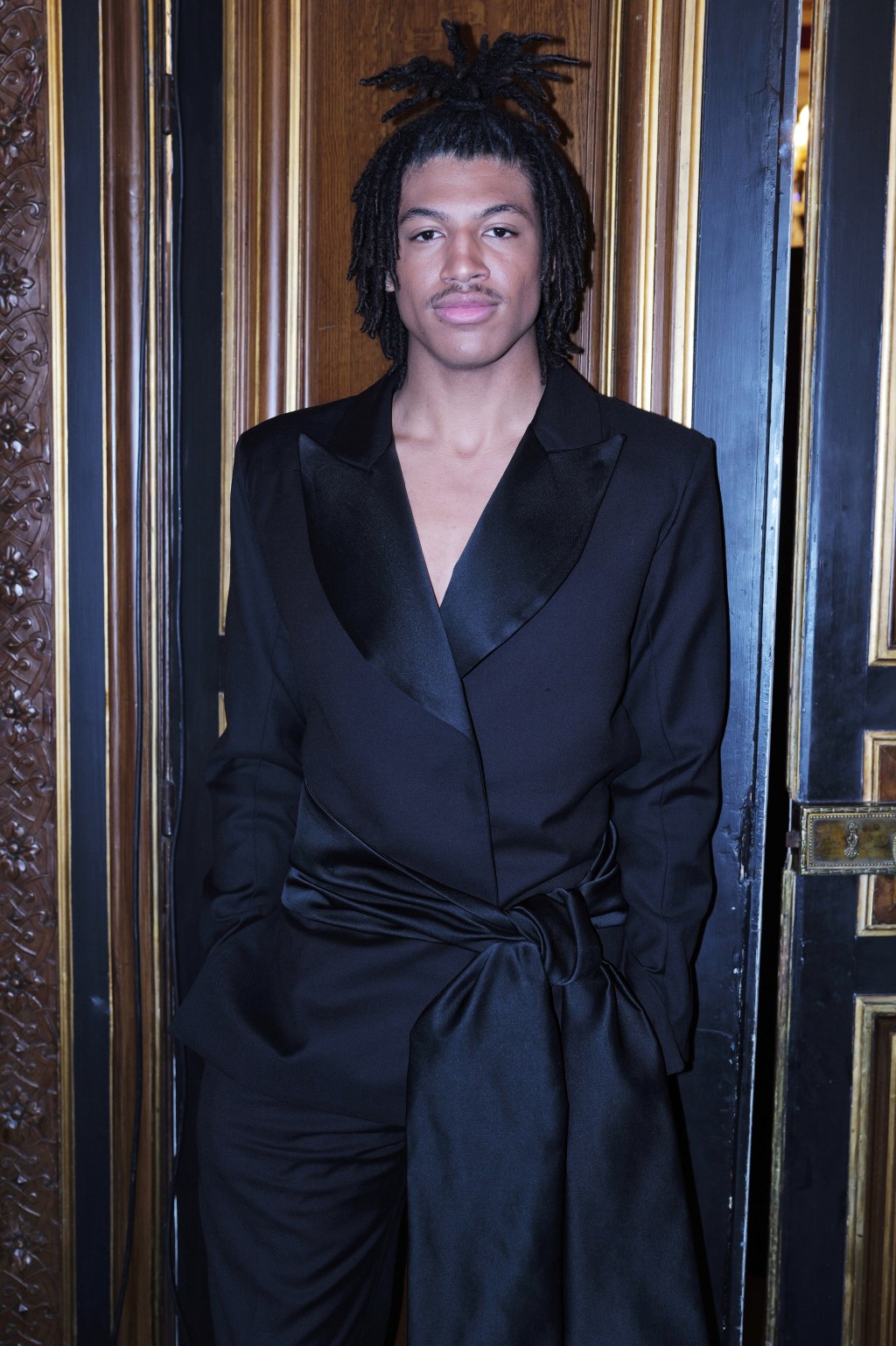 On the cover, he modeled a Brunello Cucinelli jacket, shirt and bow tie, paired with a Tiffany & Co. bangle. Getty Images