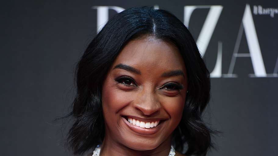 Simone Biles rocks custom fur coat while cheering on husband Jonathan Owens