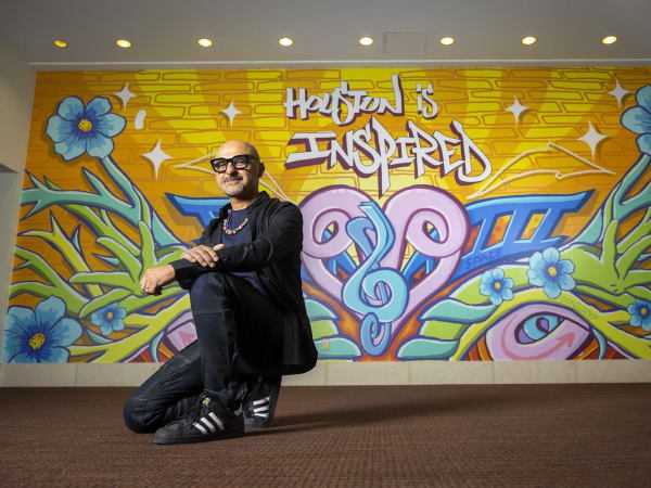Noted Houston street artist paints vibrant new mural at downtown venue