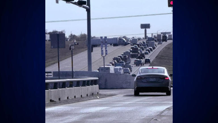 Interstate 35 closed after truck runs stop sign, crashes into concrete wall