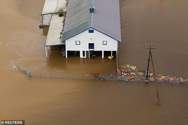 A drone view shows an area flooded by the Green River, after multiple atmospheric rivers brought rain and flooding to the Pacific Northwest, in Kent, WA