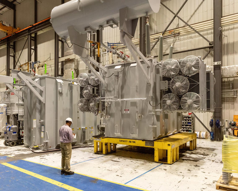 The factory workers who build the power grid by hand