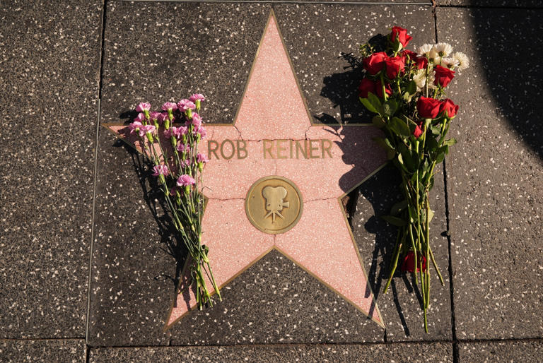 Damian Dovarganes/AP - PHOTO: Flowers cover the Walk of Fame star for Rob Reiner Monday, Dec. 15, 2025, in the Hollywood section of Los Angeles.