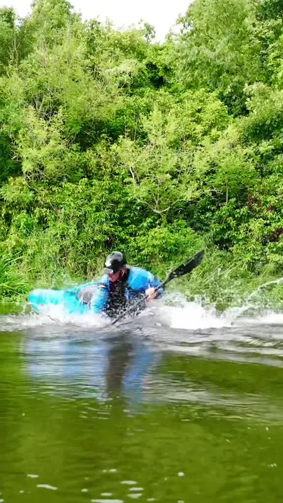 Watch my wild kayak tricks on a tranquil forest river