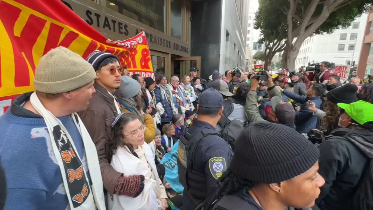 Dozens of protesters arrested after chaining themselves in front of San ...