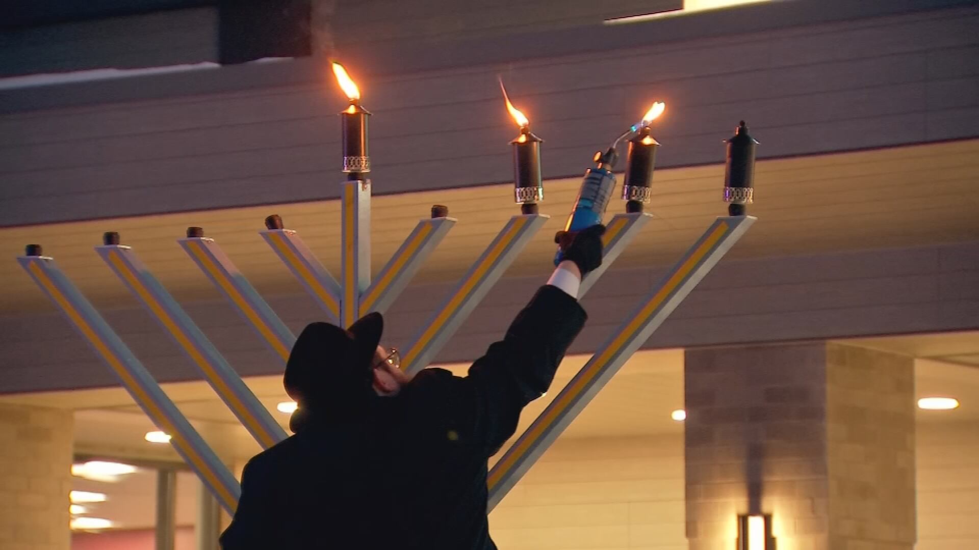 Local rabbi dedicates menorah lighting to family member shot during ...