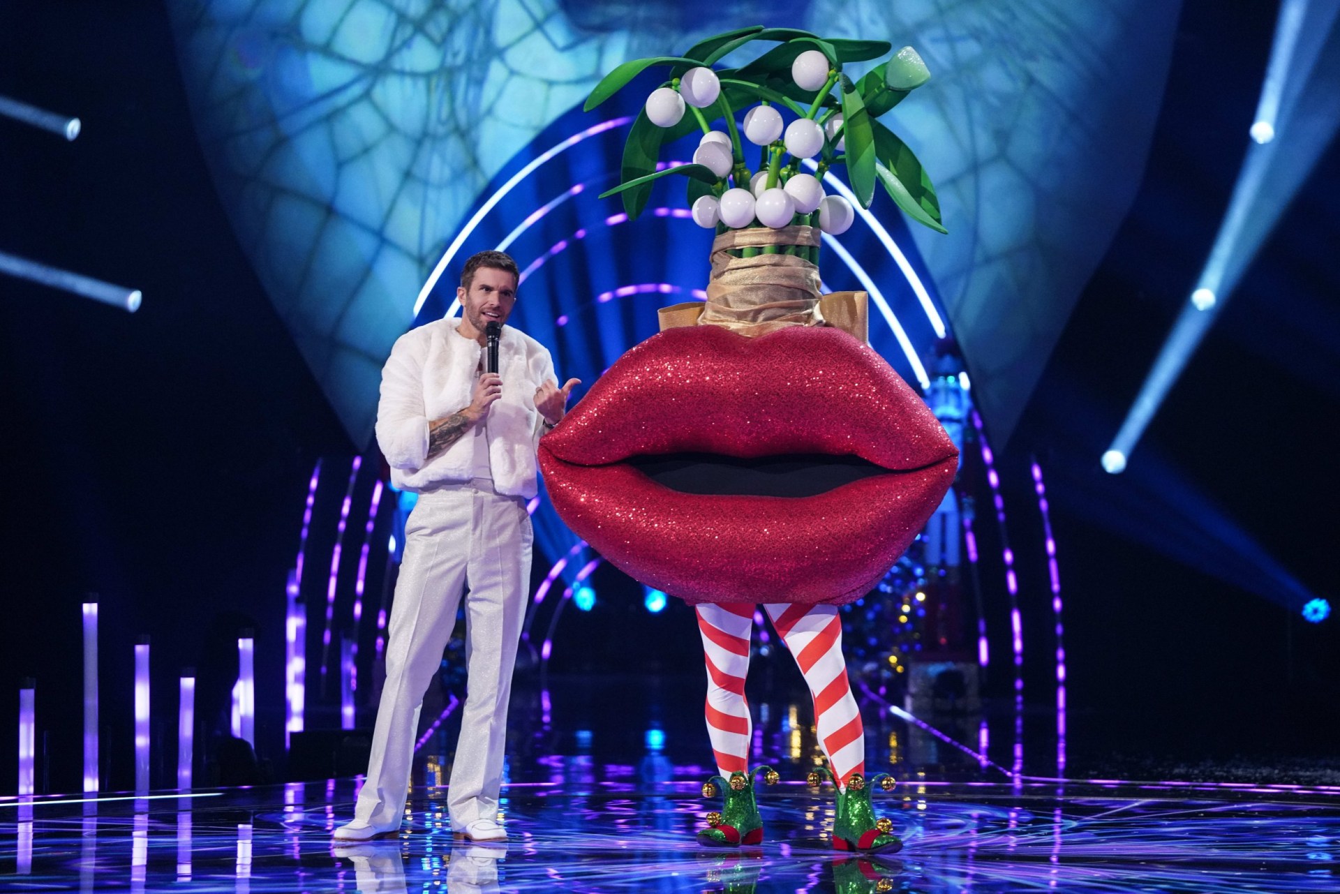 Joel Dommett and Mistletoe on stage in The Masked Singer