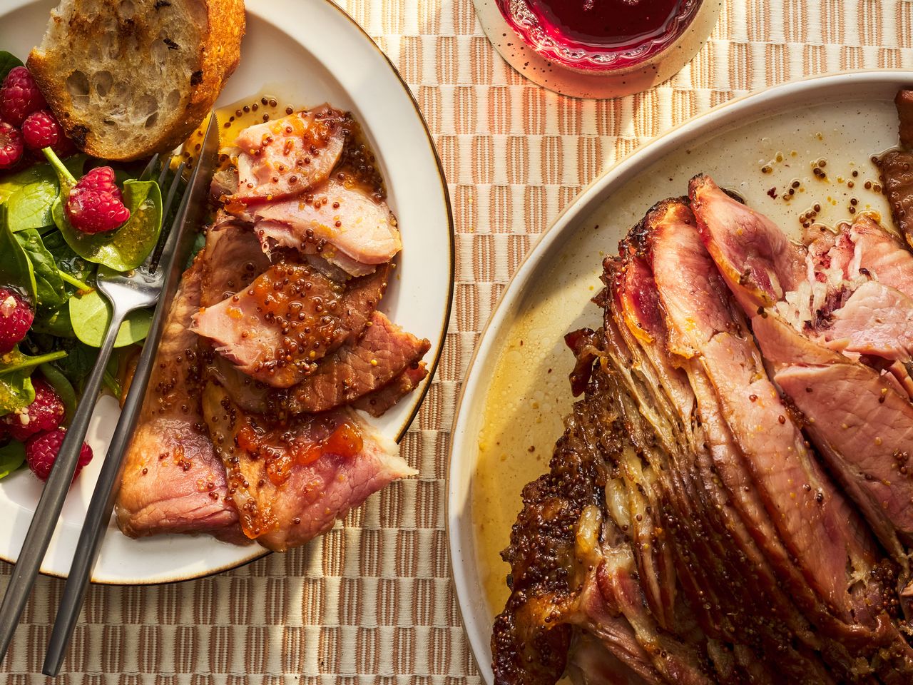Southern Living slow cooker ham on a serving platter with a plated serving beside