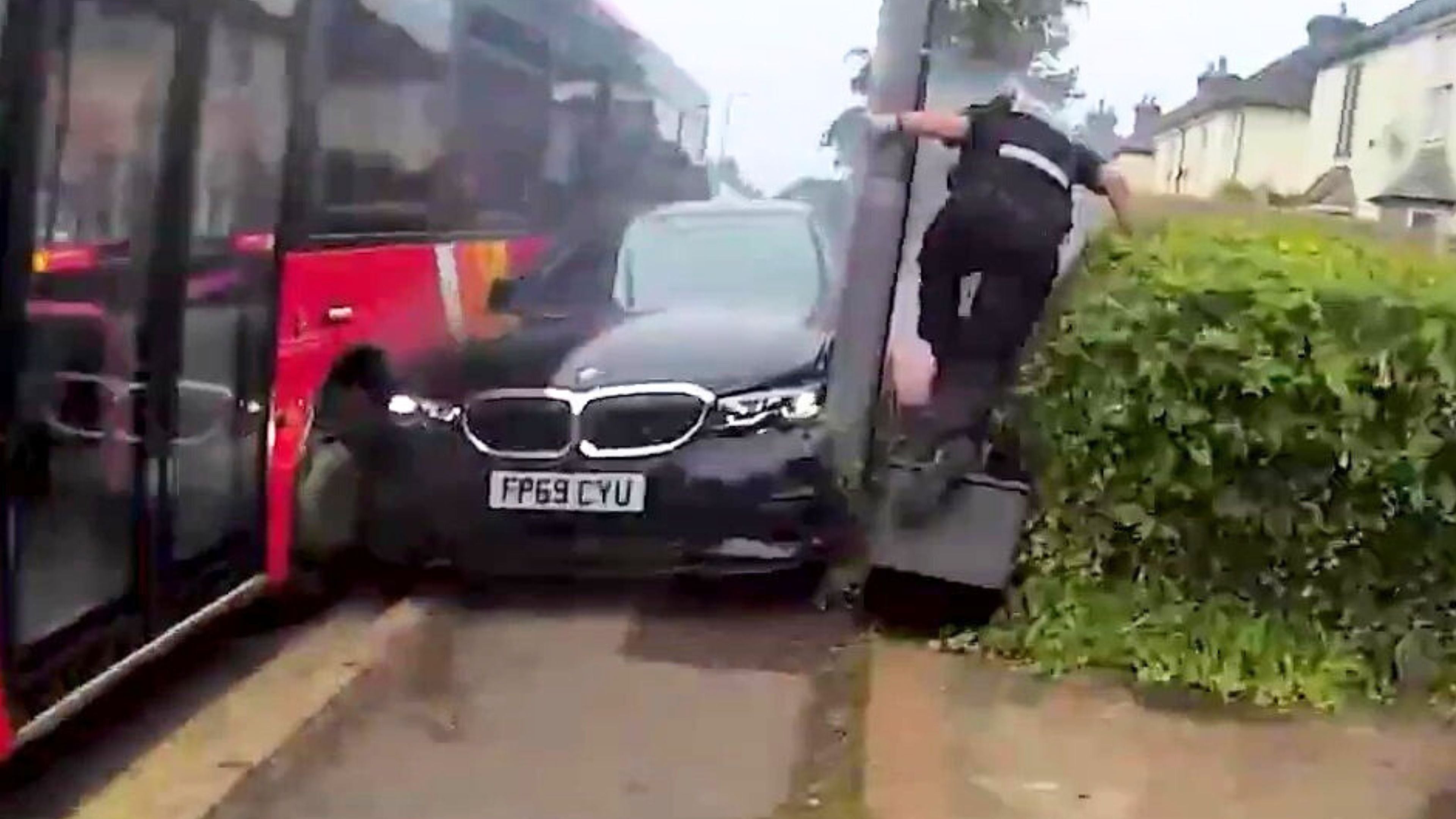 Shocking moment BMW driver mounts pavement and tries to smash through ...