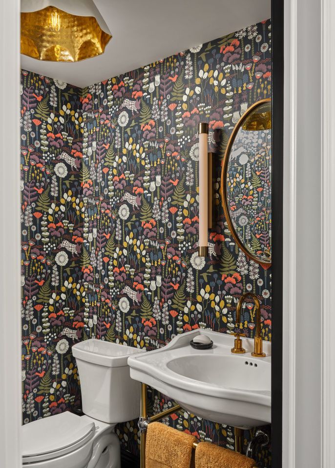 Bathroom with dark, patterned wallpaper