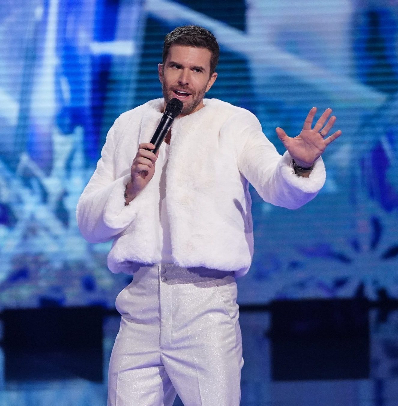Joel Dommett in an all-white outfit on The Masked Singer
