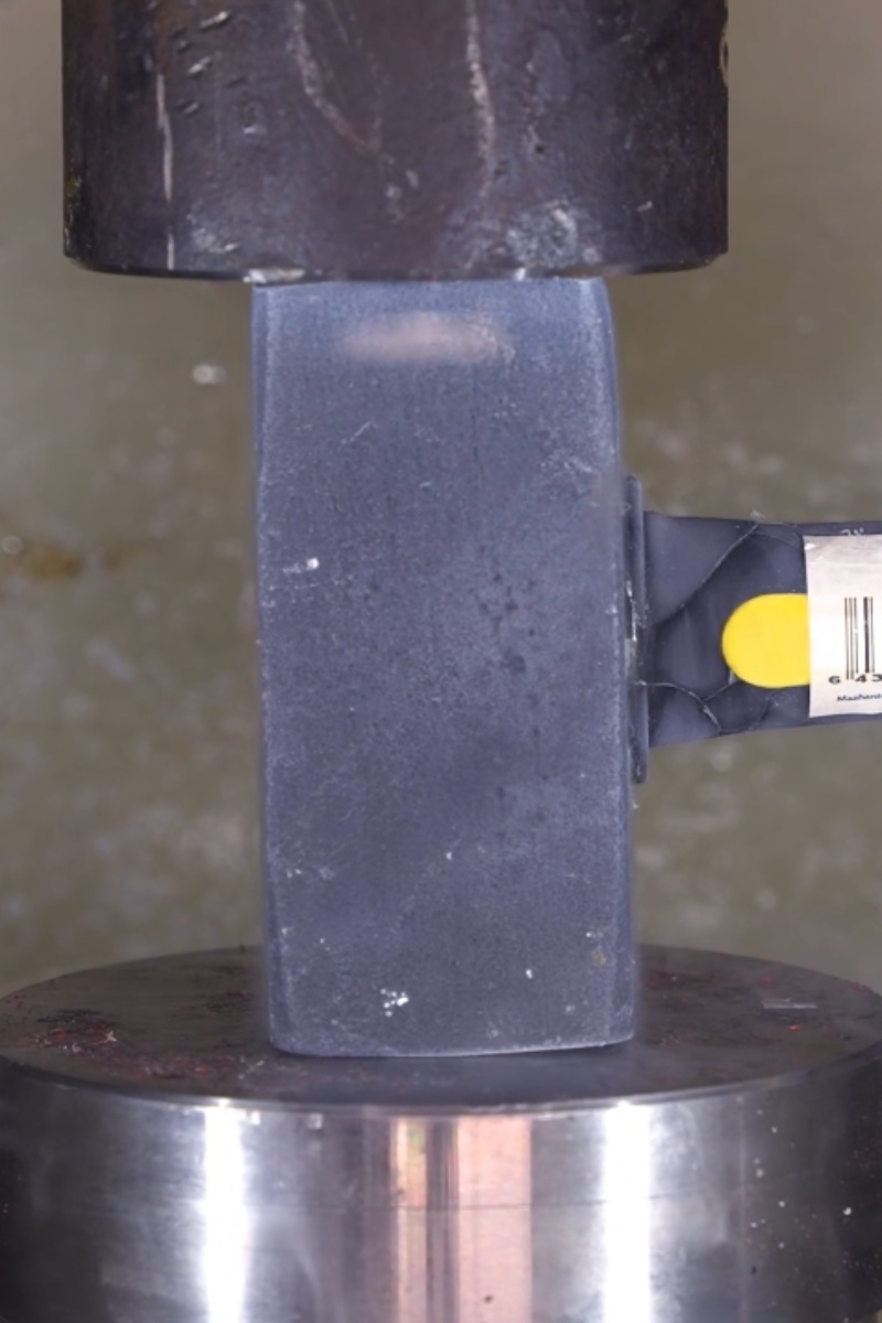Object being crushed by hydraulic press