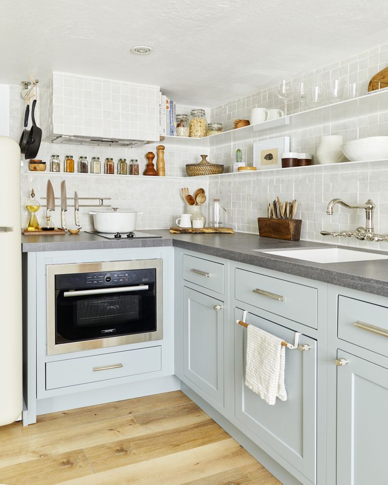 small kitchen with blue cabinets