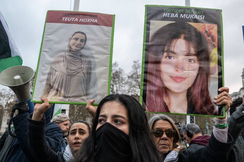 LONDON, ENGLAND - DECEMBER 15: Supporters of the Palestine Action hunger strikers protest in Parliament square while waiting for the Derry delegation on December 15, 2025 in London, England. Demonstrators are gathering to greet a delegation from Derry City and Strabane District Council who are meeting with families of Palestine Action (PA) prisoners on hunger strike. Last month the council in Northern Ireland voted to pass a motion in solidarity with the group of PA prisoners who have gone on hunger strike to demand for the closure of Elbit Systems sites in the UK, the lifting of the government's proscription against Palestine Action, and the right to fair trials. (Photo by Guy Smallman/Getty Images)