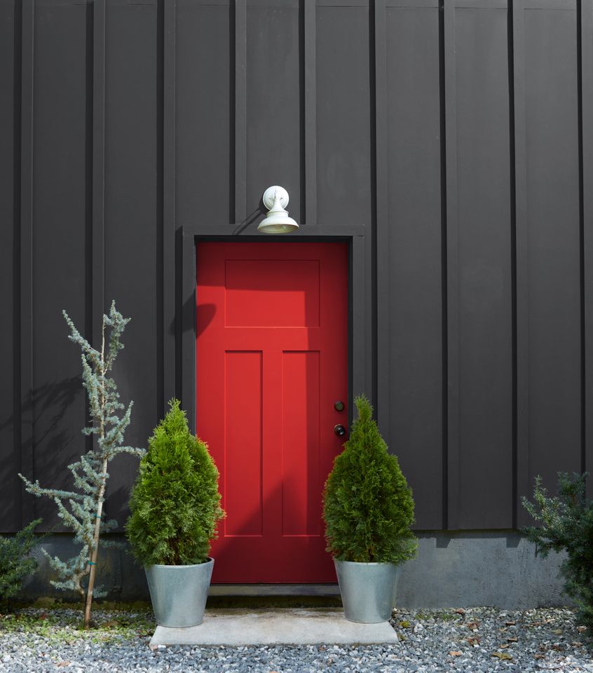 Red door with Wrought Iron color siding