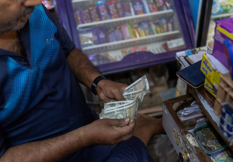 Rupee traders on alert for RBI follow-through amid risk-off mood<br><br>