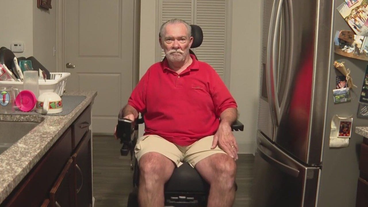 Man needs help to get wheelchair