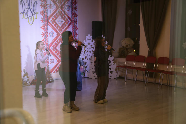 A teacher and students rehearse at Leontovych music school, which reopened in Dnipro as Russian forces advanced on the key eastern city of Pokrovsk. (Siobhán O'Grady/The Washington Post)