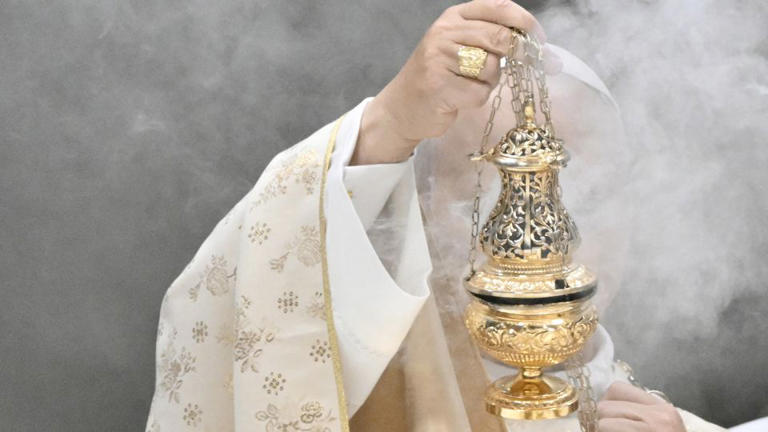 Leo holds an incent burner at St Peter's Basilica. - Tiziana Fabi/AFP/Getty Images