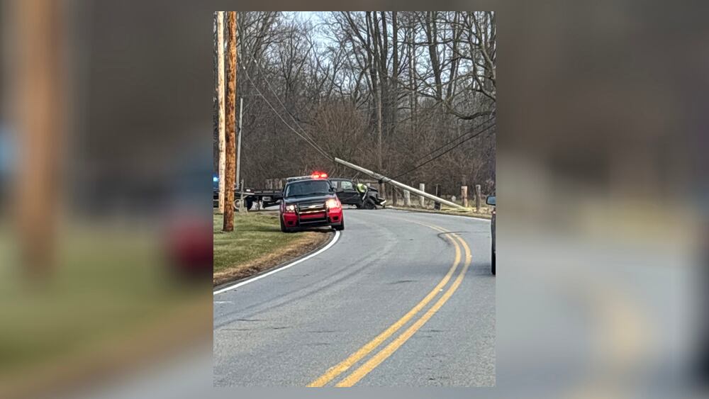 Man taken to hospital after crashing into pole