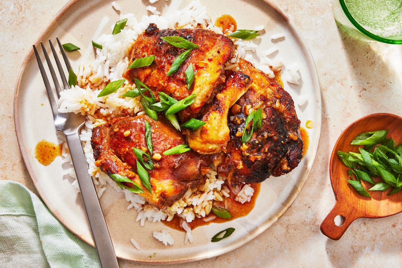 Southern Living Slow Cooker Honey Garlic Chicken served over rice on a plate