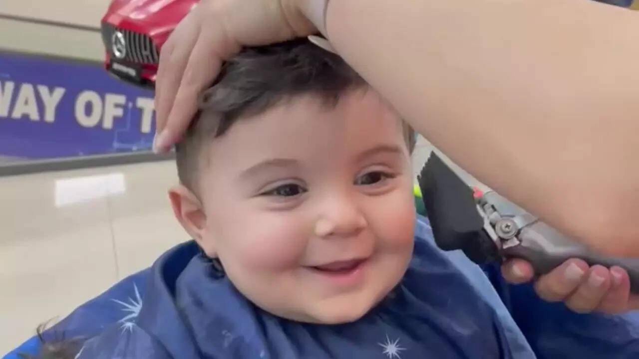 This toddler’s constant smile during a haircut is pure joy, and it will ...