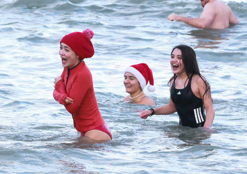 In photos: Merrymakers brave the cold for a Christmas Day dip