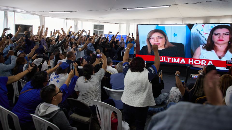 Supporters of the National Party celebrate as the National Electoral Council declares Nasry Asfura the presidential election winner in Tegucigalpa, Honduras, on December 24, 2025. - Fernando Destephen/AP