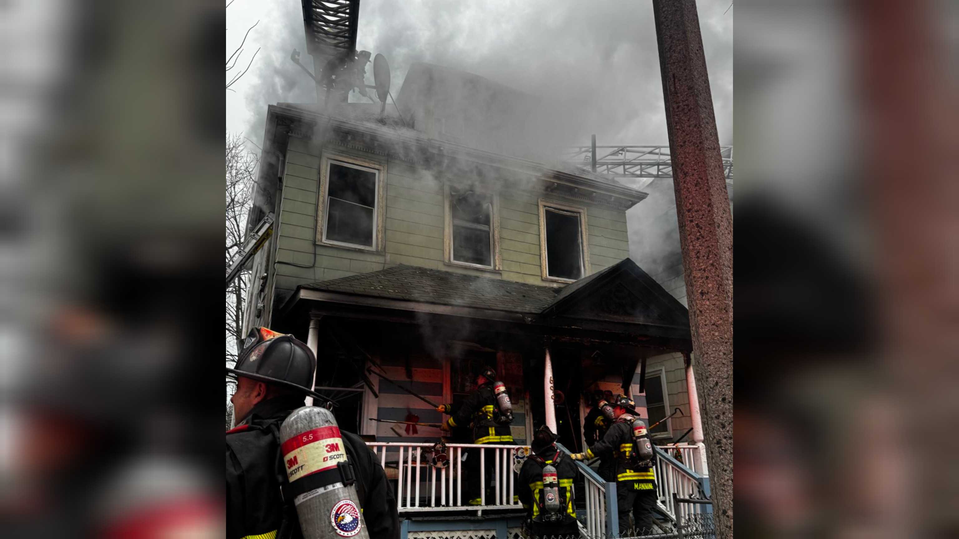 Firefighters battling two-alarm house fire in Dorchester