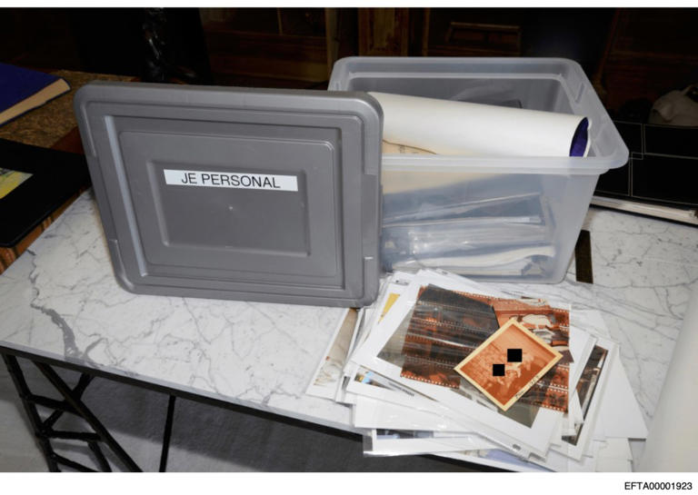 This redacted photo released by the U.S. Department of Justice shows files documented on Aug. 12, 2019, during a search of Jeffrey Epstein’s home on Little St. James island in the U.S. Virgin Islands. (U.S. Department of Justice via AP)