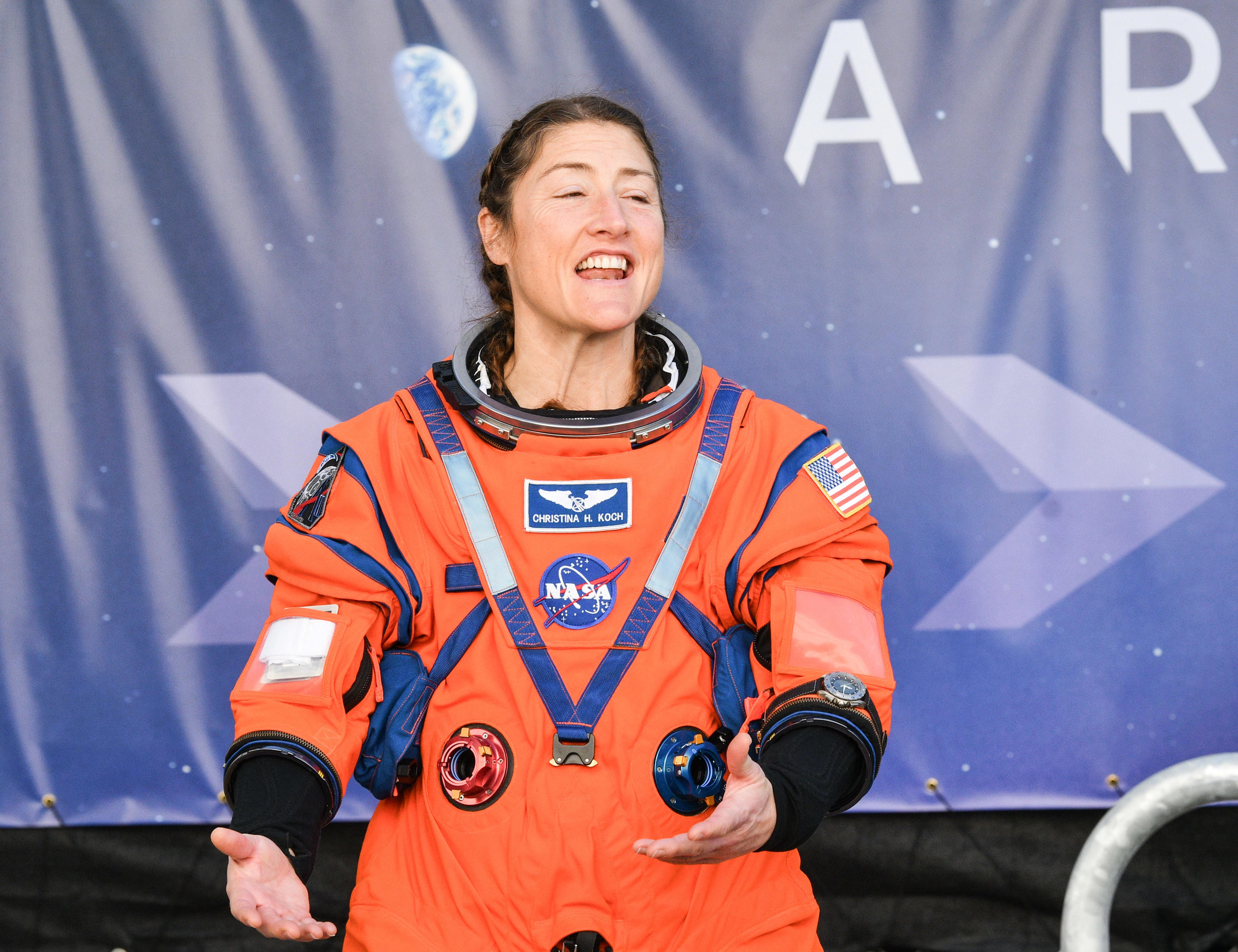 Artemis II mission specialist Christina Koch talks with spectators as the crew leaves crew quarters December 20, 2025 during their pre-launch rehearsal. Craig Bailey, FLORIDA TODAY via USA TODAY NETWORK