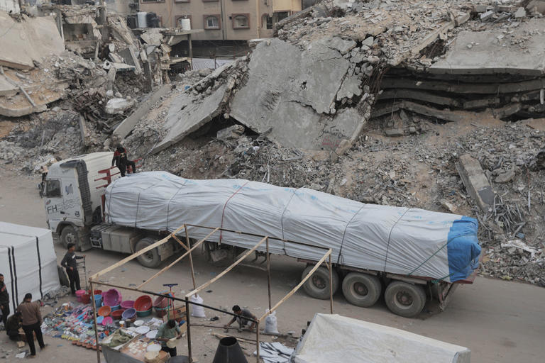 Trucks believed to be carrying humanitarian aid reach Gaza City earlier this month. (Ahmed Jihad Ibrahim Al-arini / Anadolu via Getty Images)