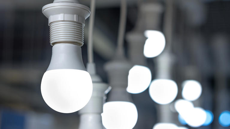 The clever lighting tip that'll update orange cabinets without touching ...