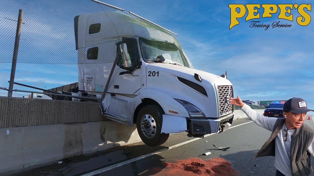 Distracted driving or brake failure? Semi crashes onto freeway!