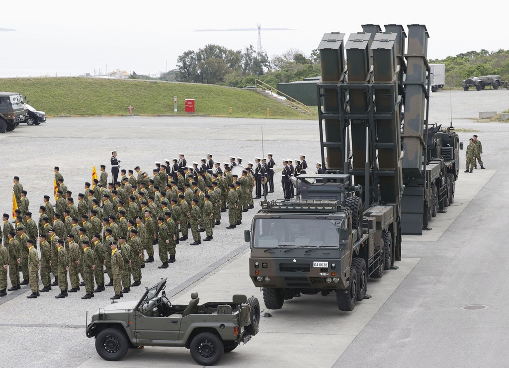 Japan's cabinet OKs record defense budget that aims to deter China