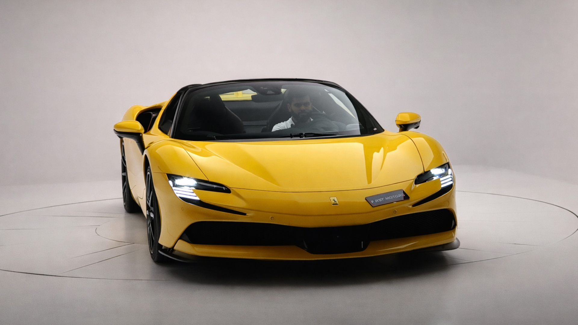 Yellow Ferrari SF90 Spider displayed at F1RST Motors