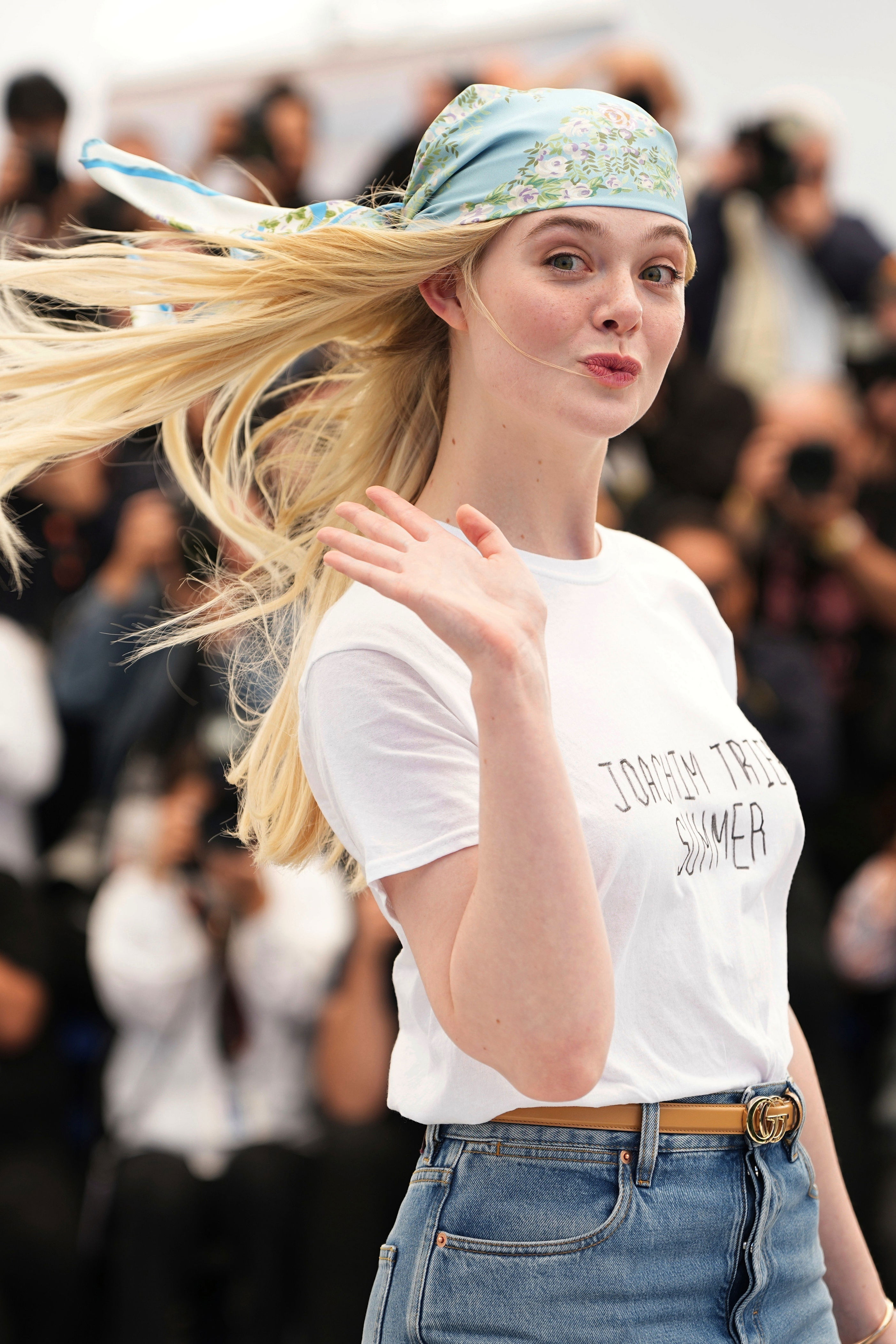 Fanning poses in a ‘Joachim Trier Summer’ T-shirt at the Cannes festival (2025 Invision)