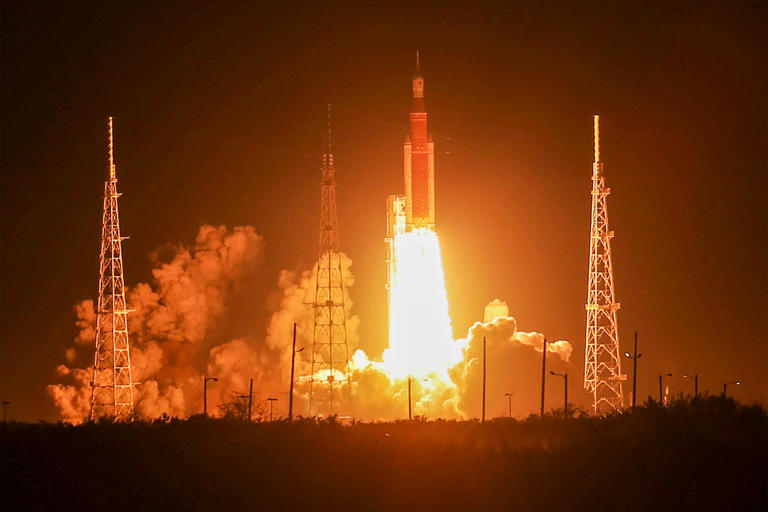 NASA's Artemis I Space Launch System rocket, with the Orion capsule attached, launches toward the moon in 2022 from NASA's Kennedy Space Center in Cape Canaveral, Fla. (Red Huber / Getty Images)