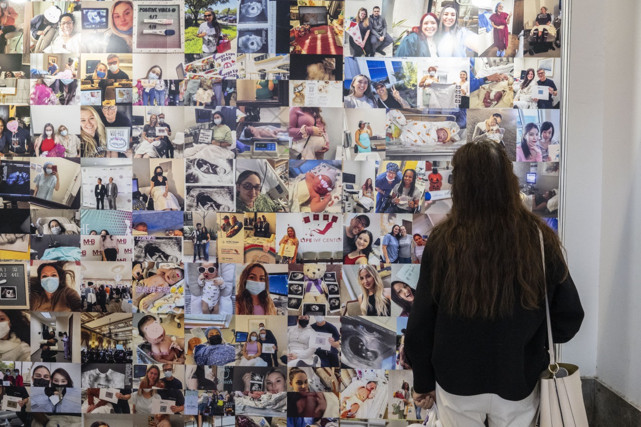 Photos at the booth of ACRC, a California surrogacy agency, at the Beijing Medical and Health Exhibition in October.