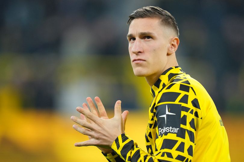 Nico Schlotterbeck acknowledges supporters ahead of Borussia Dortmund's game against Borussia Monchengladbach