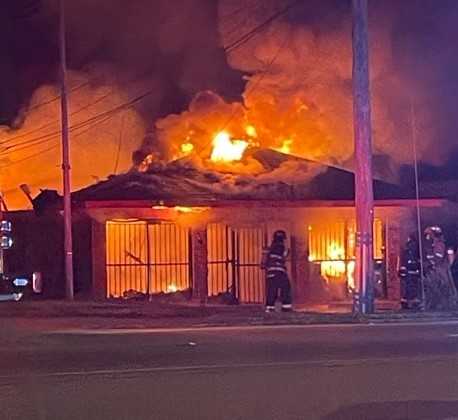 Two early morning fires gut a building and house in Jackson